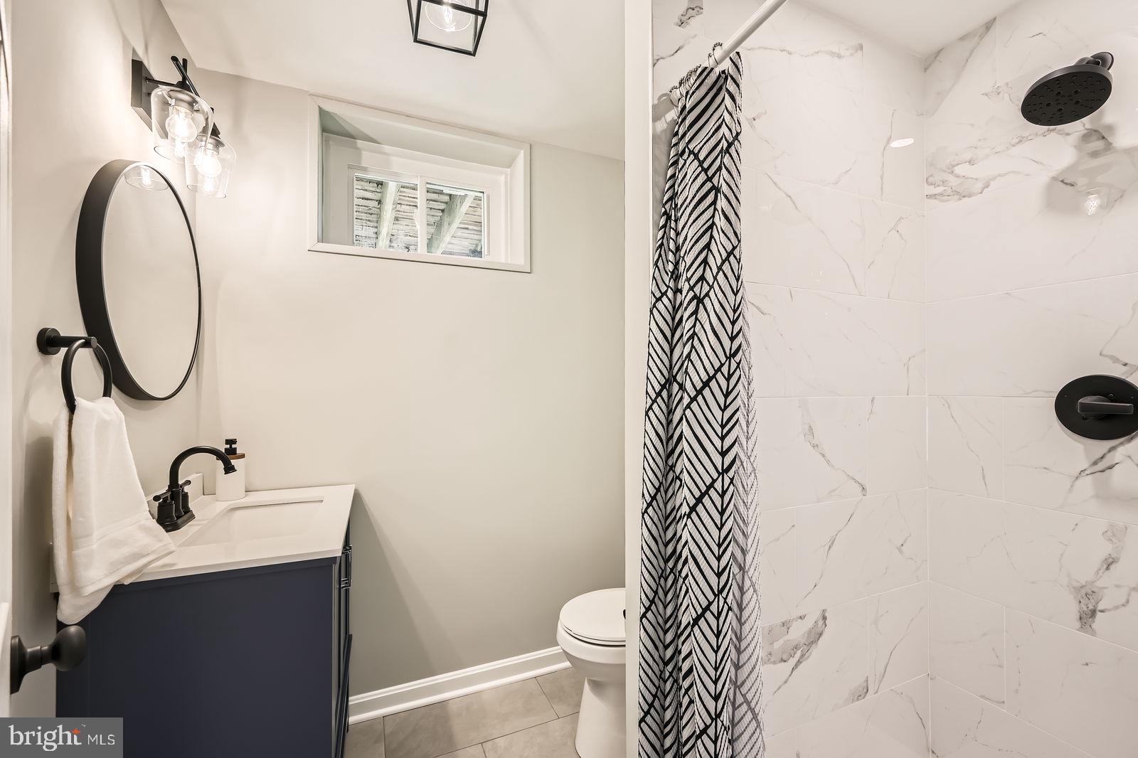 2701 Beckleysville Road Manchester, MD 21102 - Photo 24 of 39 a bathroom with a toilet sink and mirror