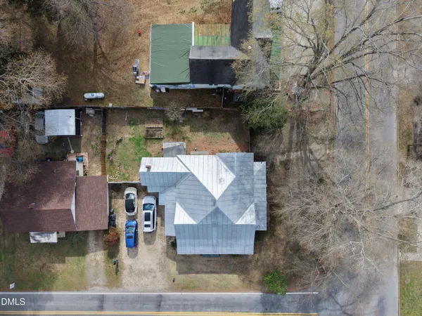 an aerial view of a house with swimming pool