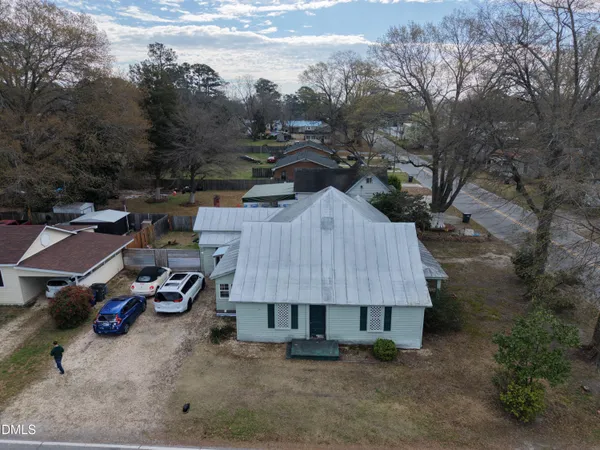 an aerial view of a house with roof deck