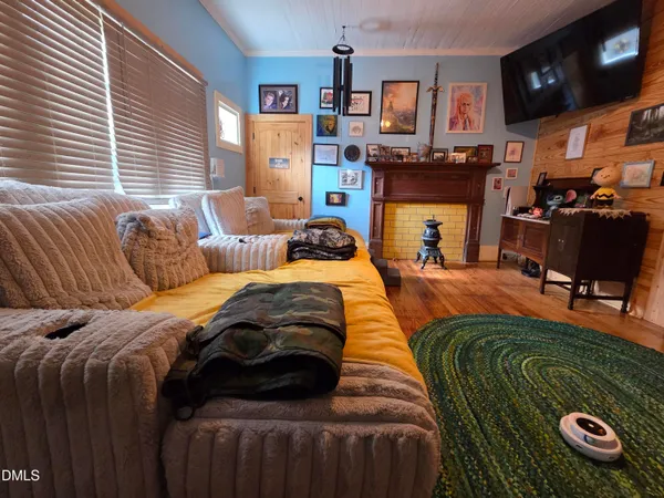 a bedroom with furniture and a fireplace