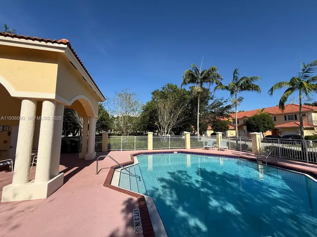 a view of a house with swimming pool