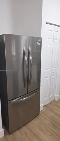 an empty room with wooden floor