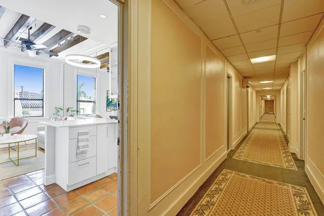 a bathroom with a sink mirror and vanity