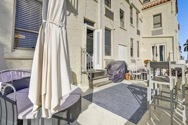 a view of a house with wooden deck