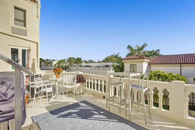 a view of a patio with swimming pool table and chairs