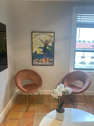 a dining room with a table and chairs