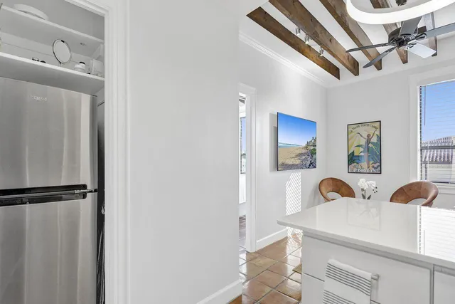 a view of a kitchen with stainless steel appliances granite countertop a sink and cabinets