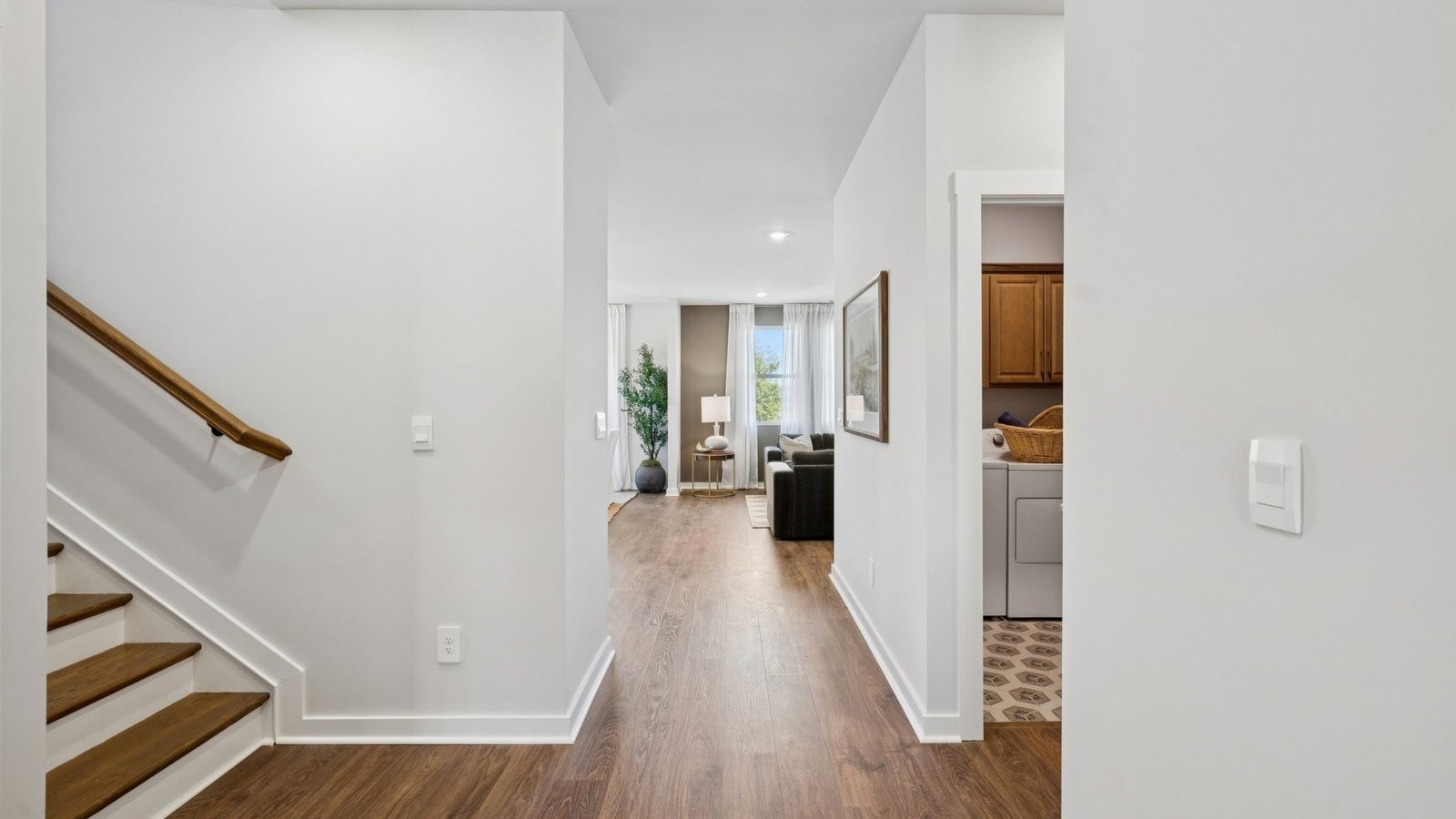 306 Harvest Point Boulevard Spring Hill, TN 37174 - Photo 14 of 70 a view of a hallway with wooden floor and staircase