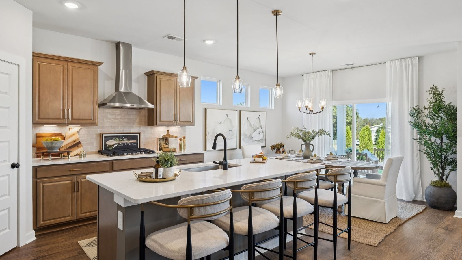 306 Harvest Point Boulevard Spring Hill, TN 37174 - Photo 16 of 70 a kitchen with stainless steel appliances granite countertop a sink a stove a refrigerator and island with wooden floor