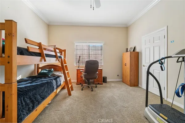 a bedroom with a workspace