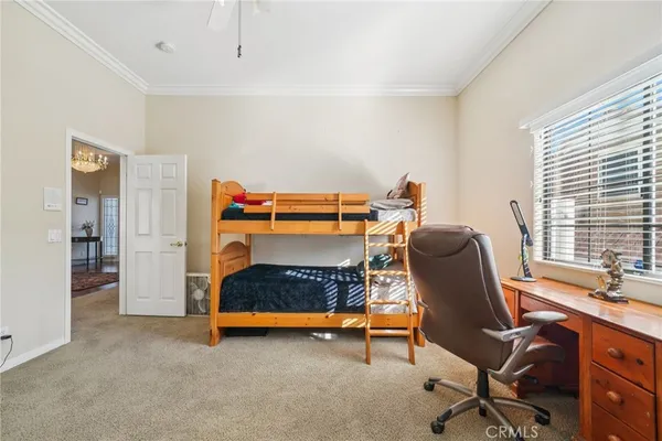 a bathroom with a toilet a sink a mirror and vanity