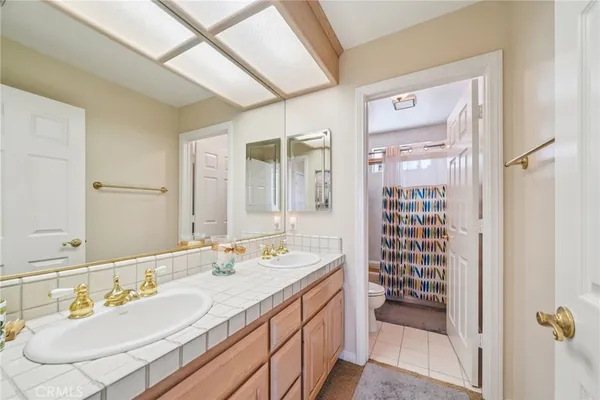 a bathroom with a shower curtain and a sink