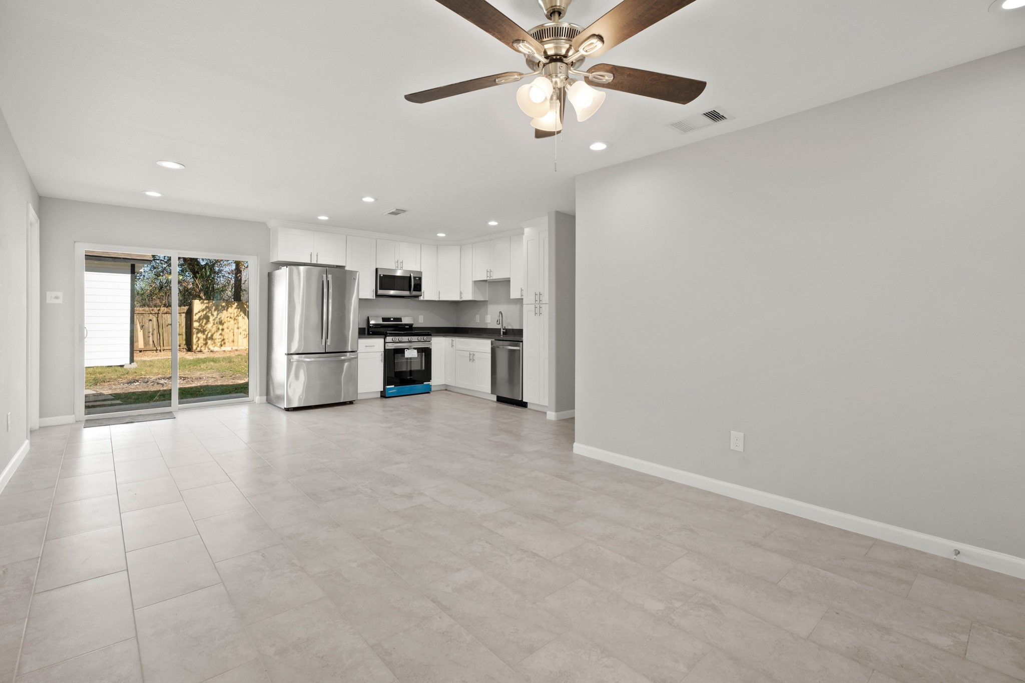 5123 Ridgeway Drive Houston, TX 77033 - Photo 4 of 21 This space is perfect for entertaining with a fantastic open layout between the living, kitchen, and dining areas.