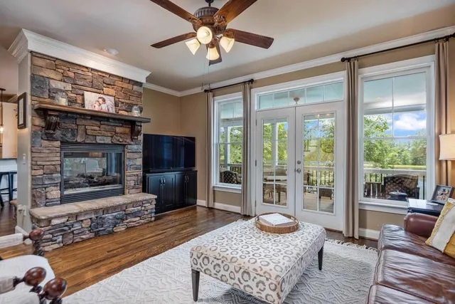 a kitchen with a table chairs refrigerator and cabinets