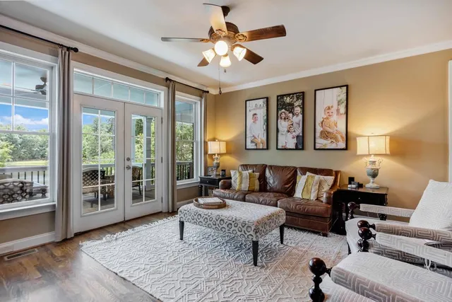 a kitchen with stainless steel appliances granite countertop a sink refrigerator and cabinets