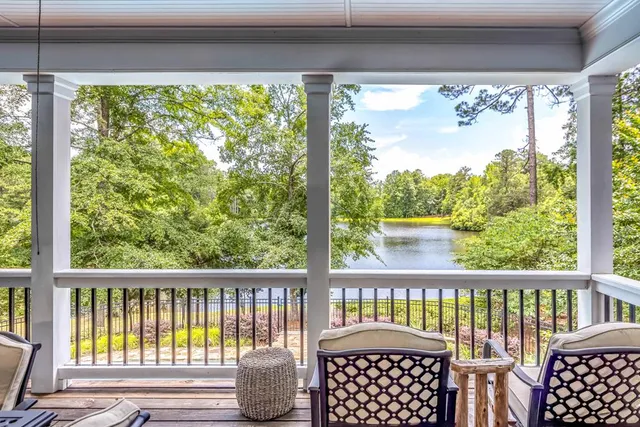 a kitchen with stainless steel appliances granite countertop a sink refrigerator and cabinets