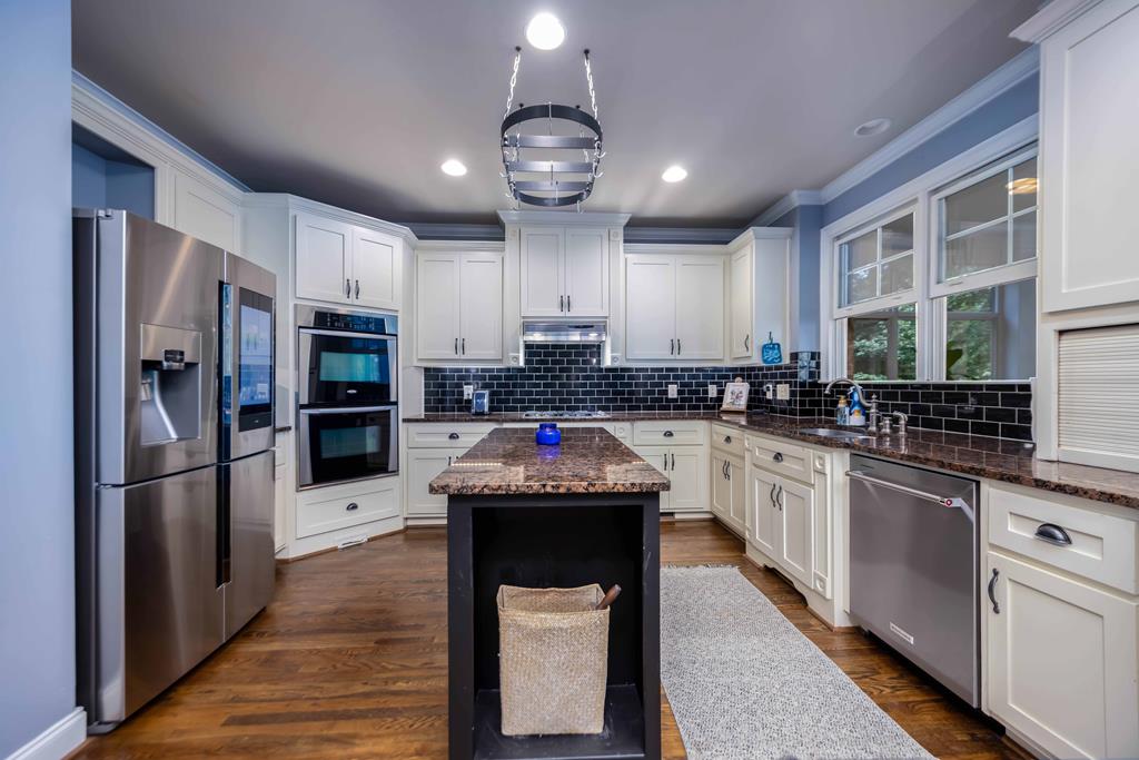 178 Rolling Farm Way Midland, GA 31820 - Photo 17 of 65 a kitchen with stainless steel appliances granite countertop a sink refrigerator and cabinets