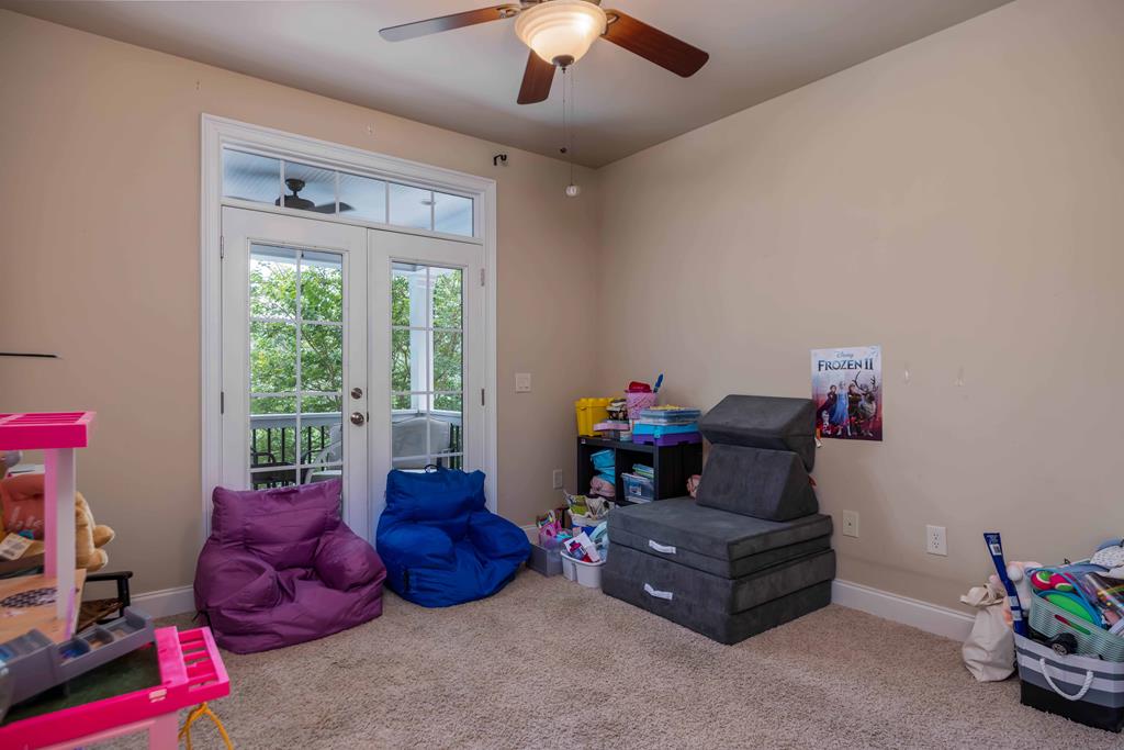 178 Rolling Farm Way Midland, GA 31820 - Photo 26 of 65 a living room with furniture and a chandelier