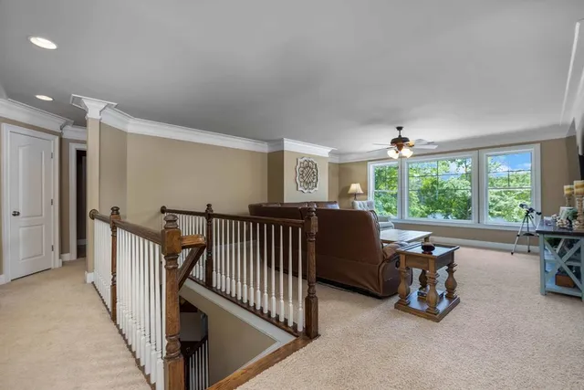 a bedroom with bunk bed and a window