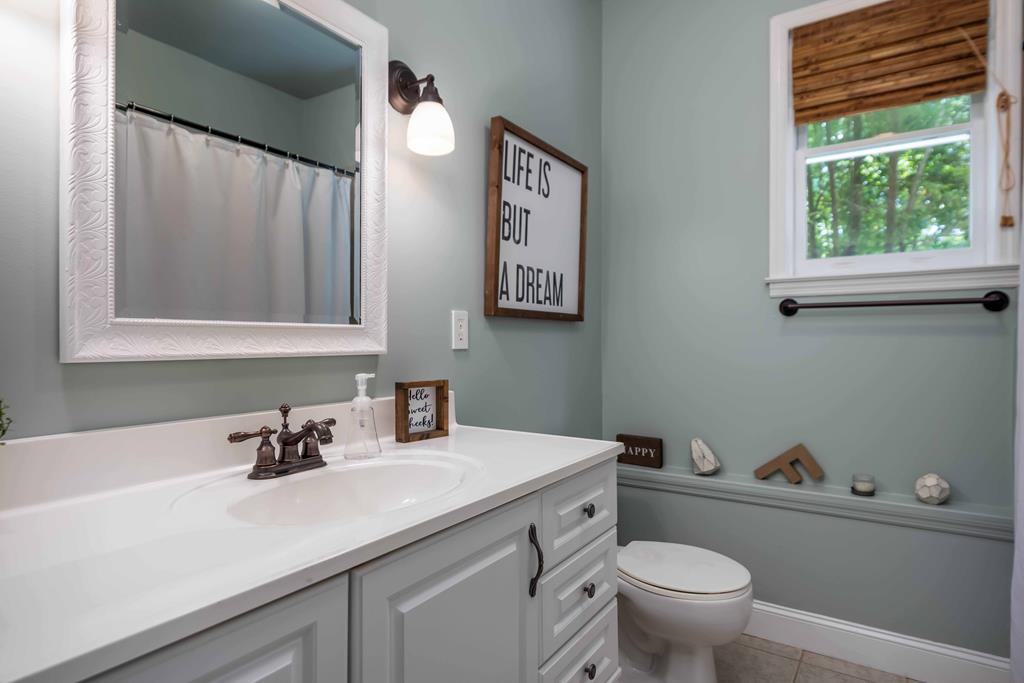 178 Rolling Farm Way Midland, GA 31820 - Photo 47 of 65 a bathroom with a sink and a toilet