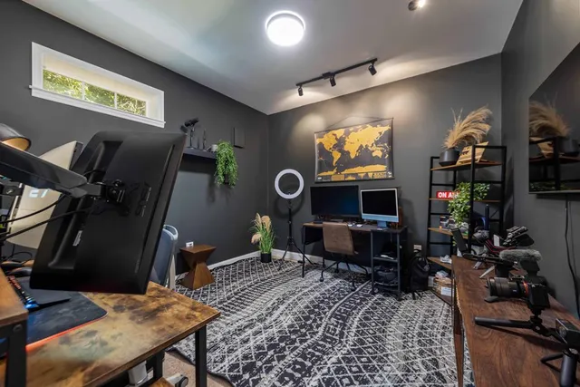 a front view of a house with swimming pool and porch