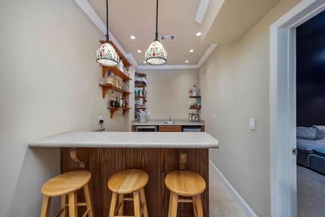 an aerial view of a house with a yard and lake view