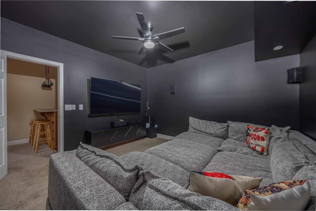 178 Rolling Farm Way Midland, GA 31820 - Photo 52 of 65 a living room with furniture and a flat screen tv