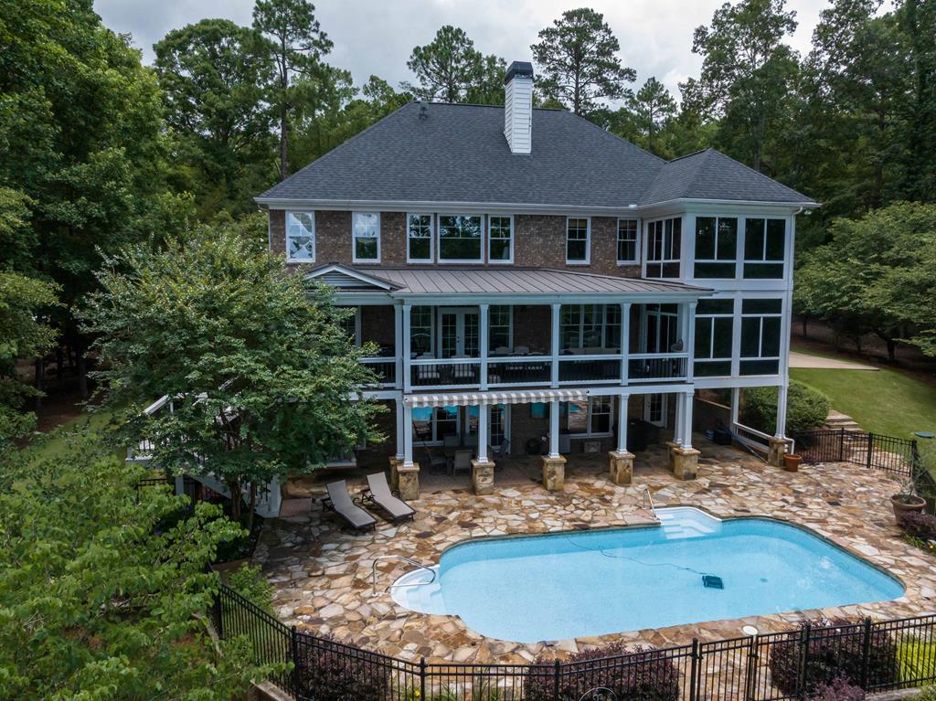178 Rolling Farm Way Midland, GA 31820 - Photo 62 of 65 a front view of a house with swimming pool and porch