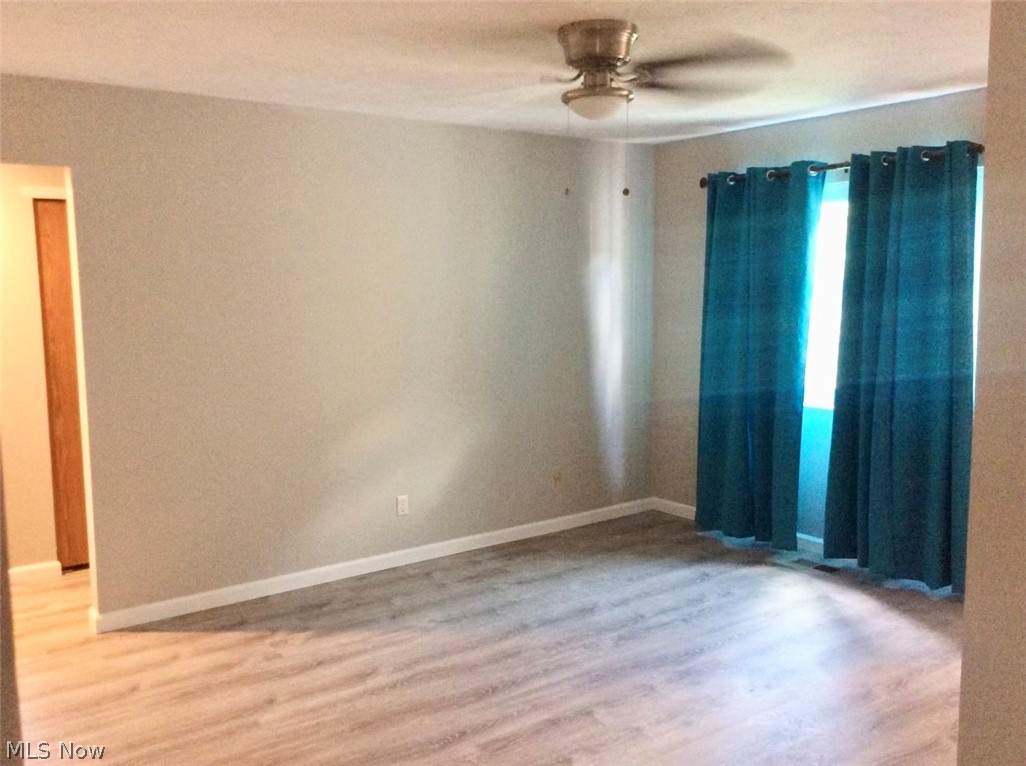 10071 Hazelton Road Streetsboro, OH 44241 - Photo 13 of 16 Unfurnished room featuring ceiling fan and hardwood / wood-style flooring