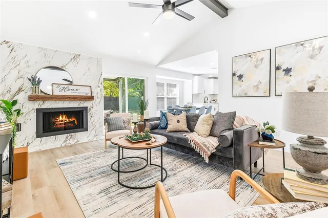 a living room with furniture and a fireplace