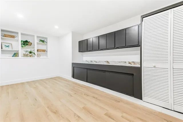 a kitchen with stainless steel appliances wooden cabinets and a sink