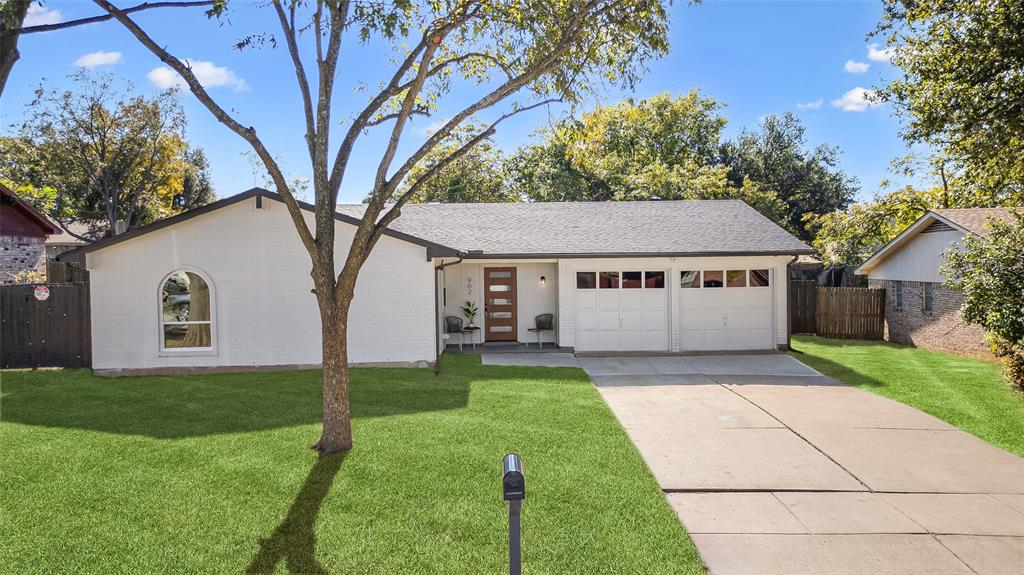 902 Warrington Court Arlington, TX 76014 - Photo 2 of 30 a house with green field in front of it