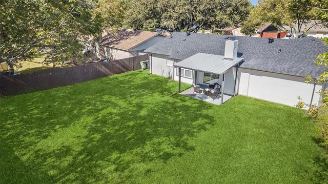 an aerial view of a house with a garden