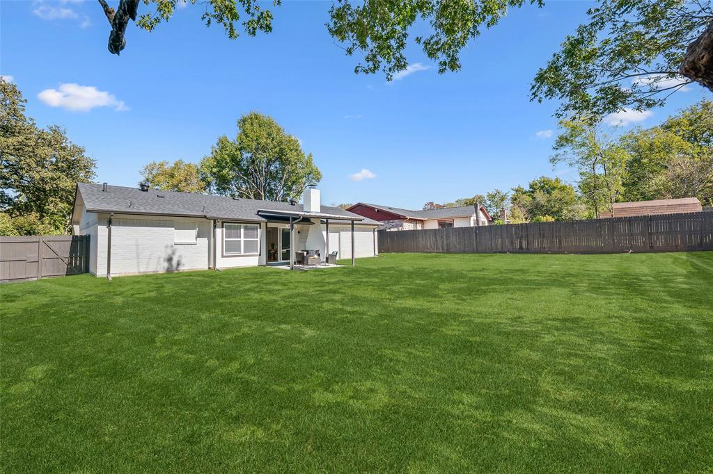 902 Warrington Court Arlington, TX 76014 - Photo 24 of 30 a view of a house with a yard