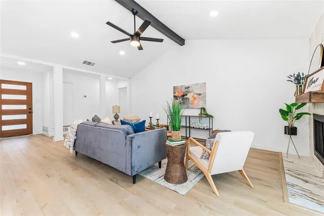 a living room with furniture and a window