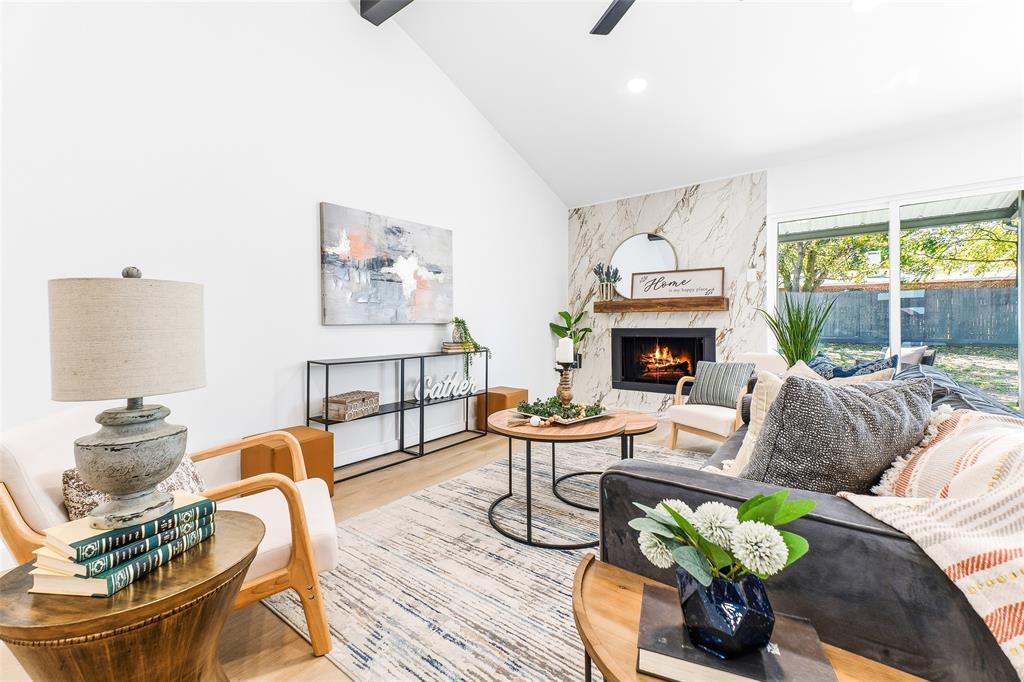 902 Warrington Court Arlington, TX 76014 - Photo 6 of 30 a living room with furniture fireplace and a large window