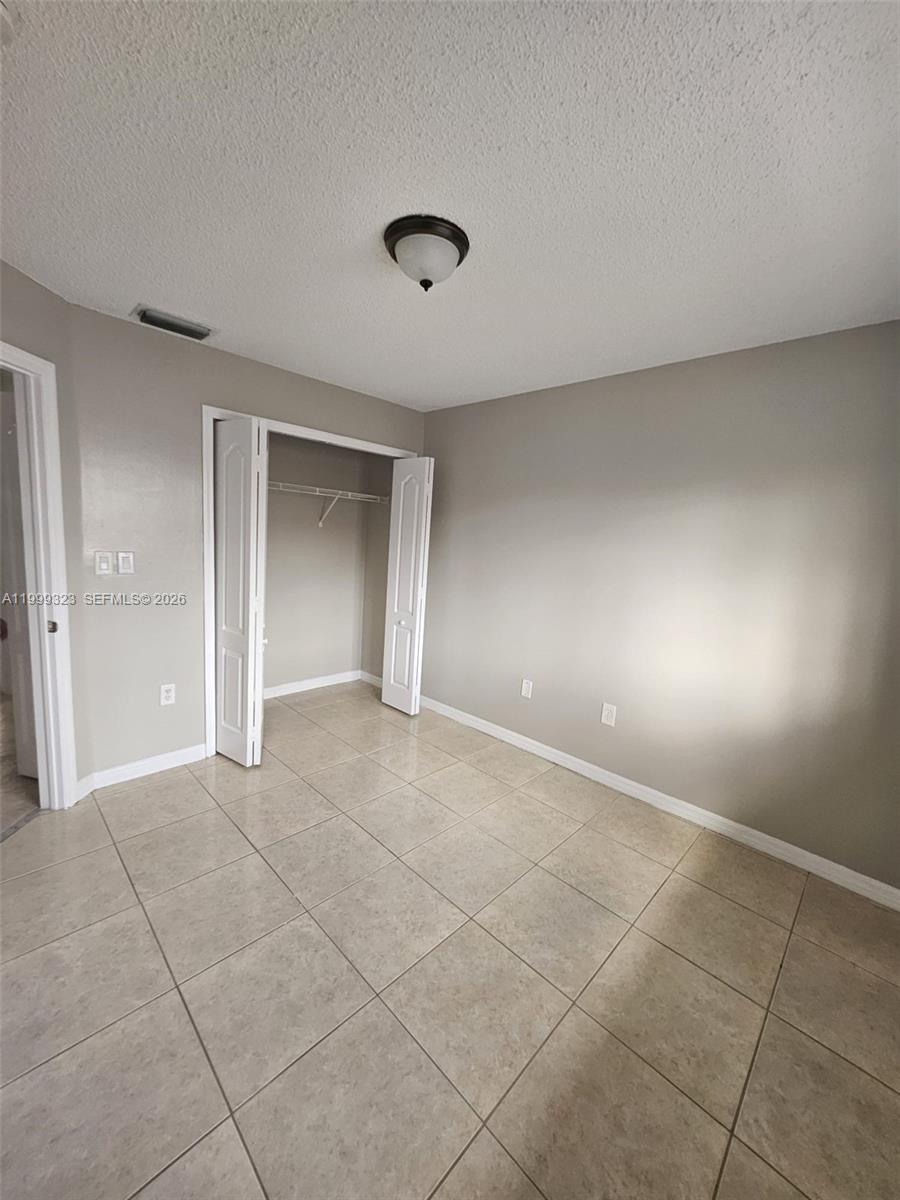 2527 West 76th Street, Unit 208 Hialeah, FL 33016 - Photo 17 of 24 a view of an empty room