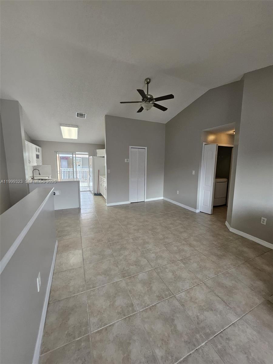 2527 West 76th Street, Unit 208 Hialeah, FL 33016 - Photo 2 of 24 a view of a kitchen with a sink and a refrigerator