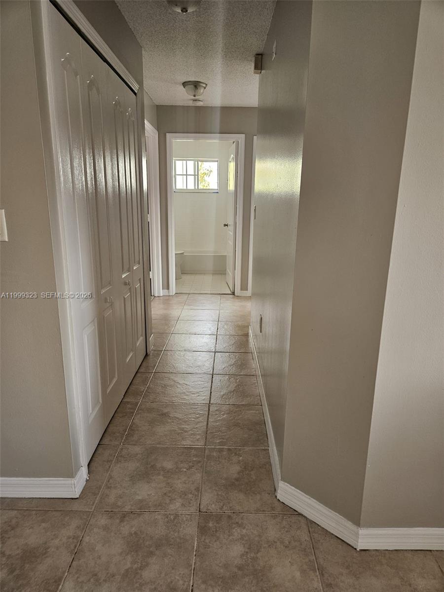 2527 West 76th Street, Unit 208 Hialeah, FL 33016 - Photo 7 of 24 a view of hallway with shower