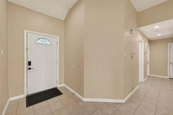 a view of a hallway to rooms