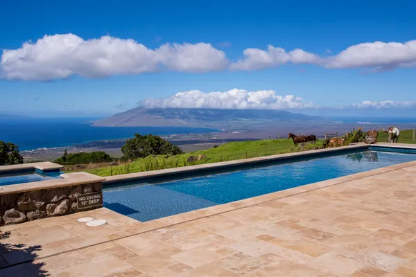 a view of swimming pool from a balcony
