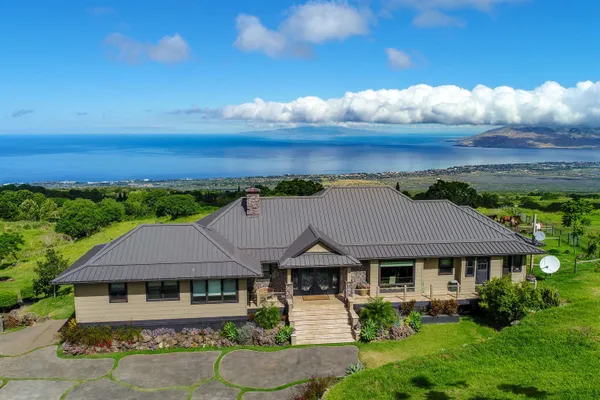 a aerial view of a house with a garden