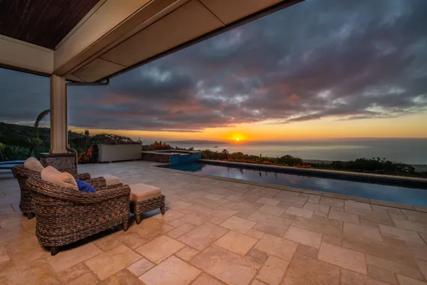 a view of swimming pool with outdoor seating