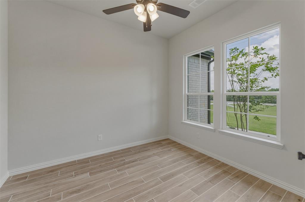 8861 County Road 623 Blue Ridge, TX 75424 - Photo 12 of 25 Bright interior space featuring wood-finish plank flooring and white baseboards