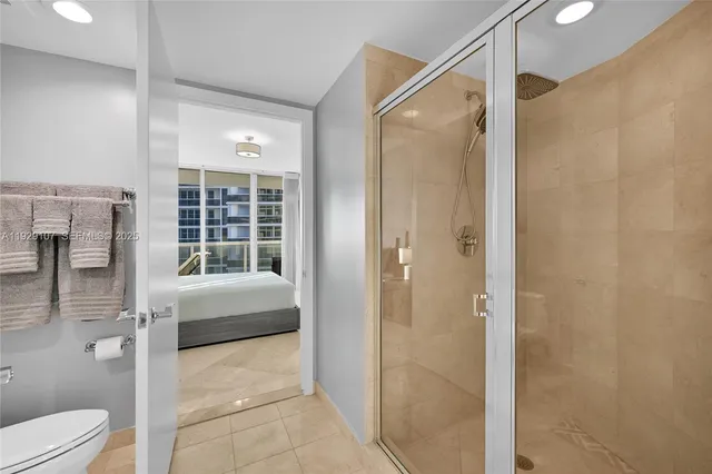 a bathroom with a shower and a toilet