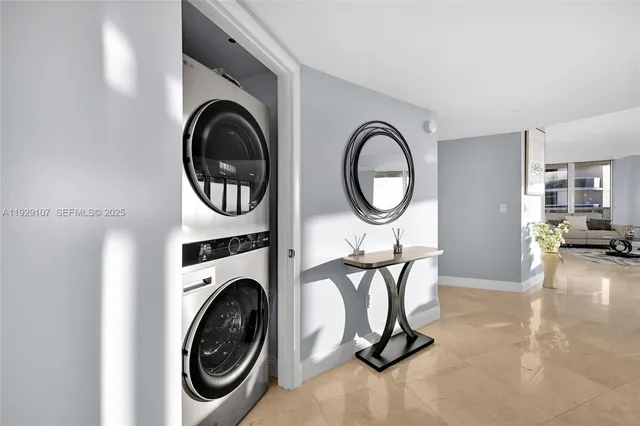 a view of a storage and utility room with washer and dryer