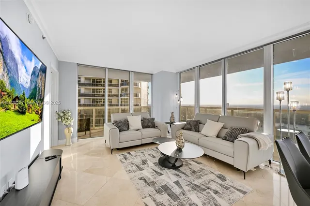 a living room with furniture and a large window