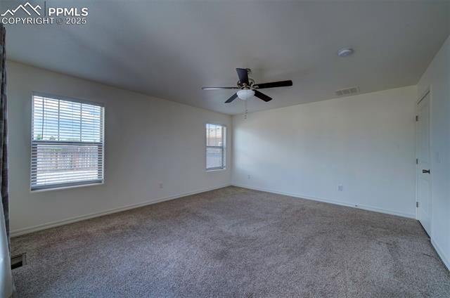 6604 Watusi Road Peyton, CO 80831 - Photo 20 of 40 Unfurnished room featuring carpet floors, ceiling fan, and a smoke detector
