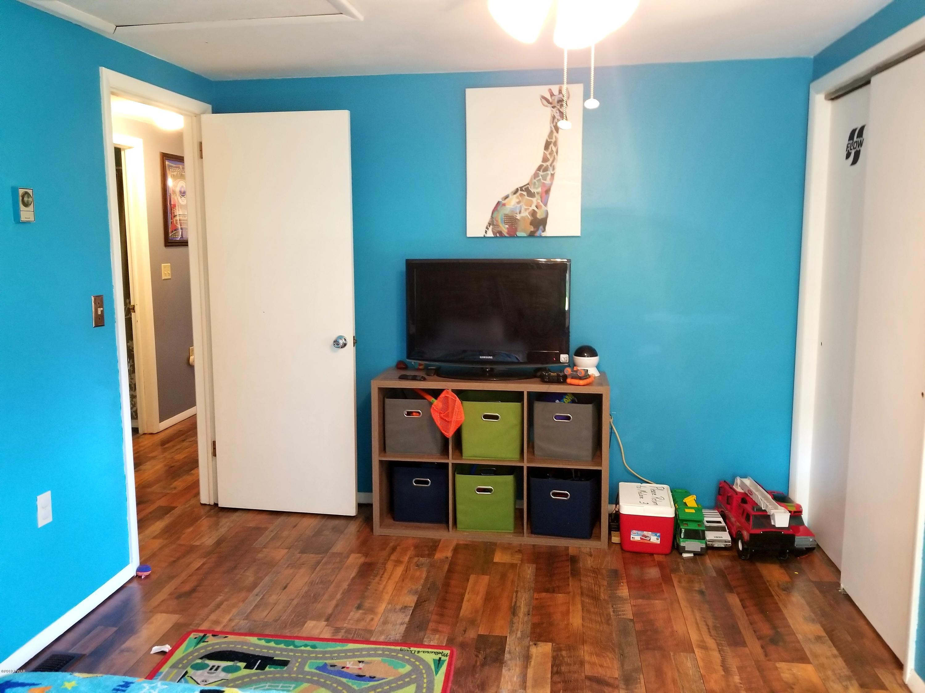 144 Mid Valley Road Lake Ariel, PA 18436 - Photo 38 of 55 a room with furniture and a flat screen tv