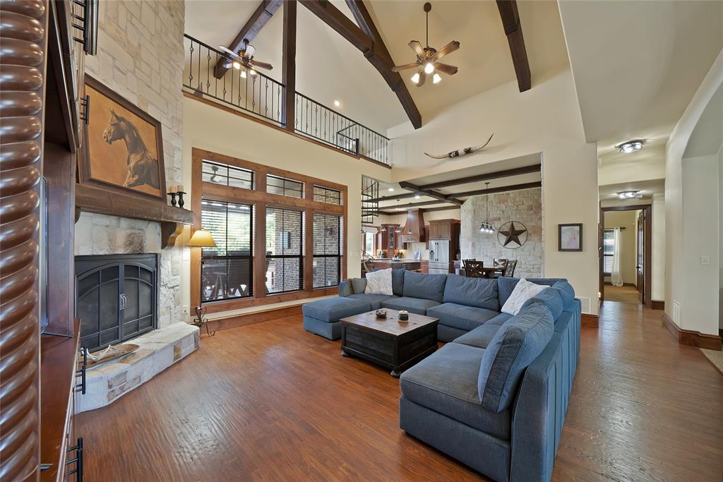 7421 Dawn Avenue Pilot Point, TX 76258 - Photo 11 of 40 a living room with furniture fireplace and wooden floor